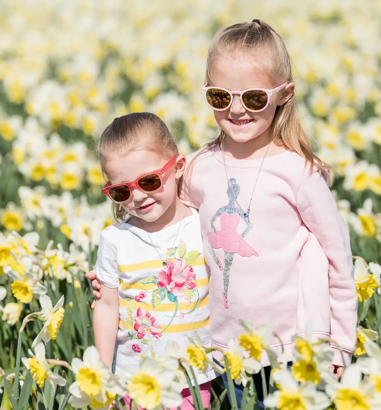 Children Smiling in daffodil field
