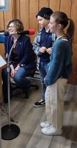 young girl standing to give presentation