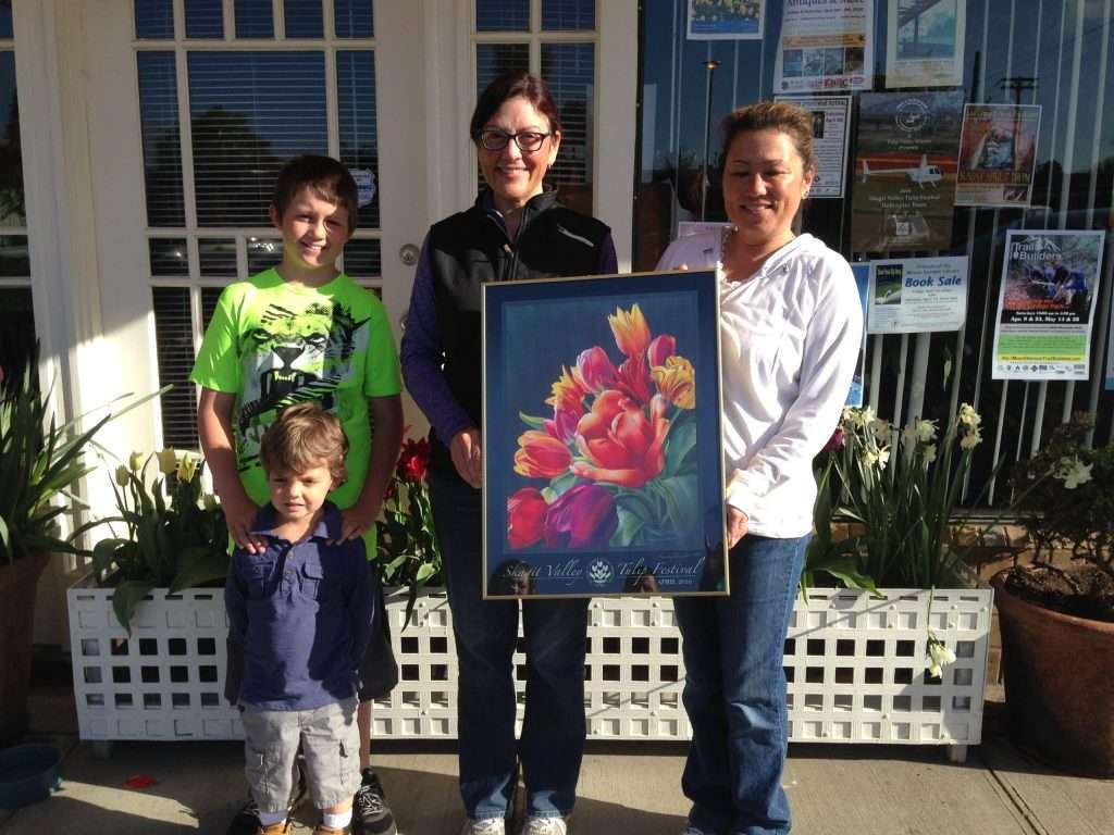 family holding 20165 tulip festival poster