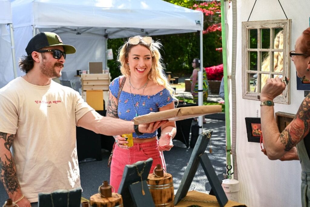 Visitors enjoying local vendors at Skagit Valley Tulip Festival.