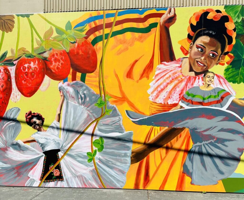 Colorful Burlington street mural with folklórico dancers and strawberries near the Skagit Valley Tulip Festival.