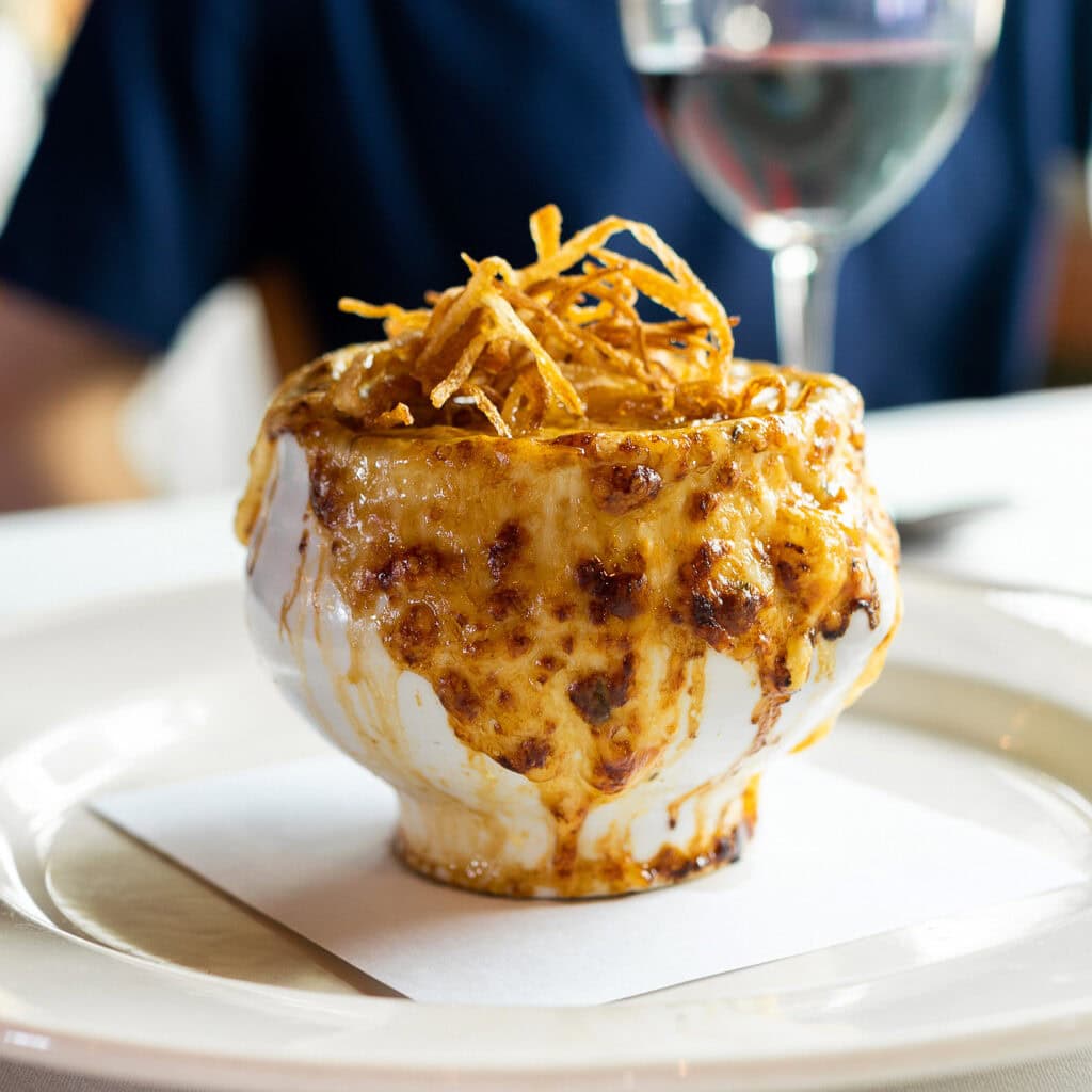 Baked French onion soup overflowing with melted cheese and crispy onions at Nell Thorn Waterfront Bistro & Bar near the Skagit Valley Tulip Festival