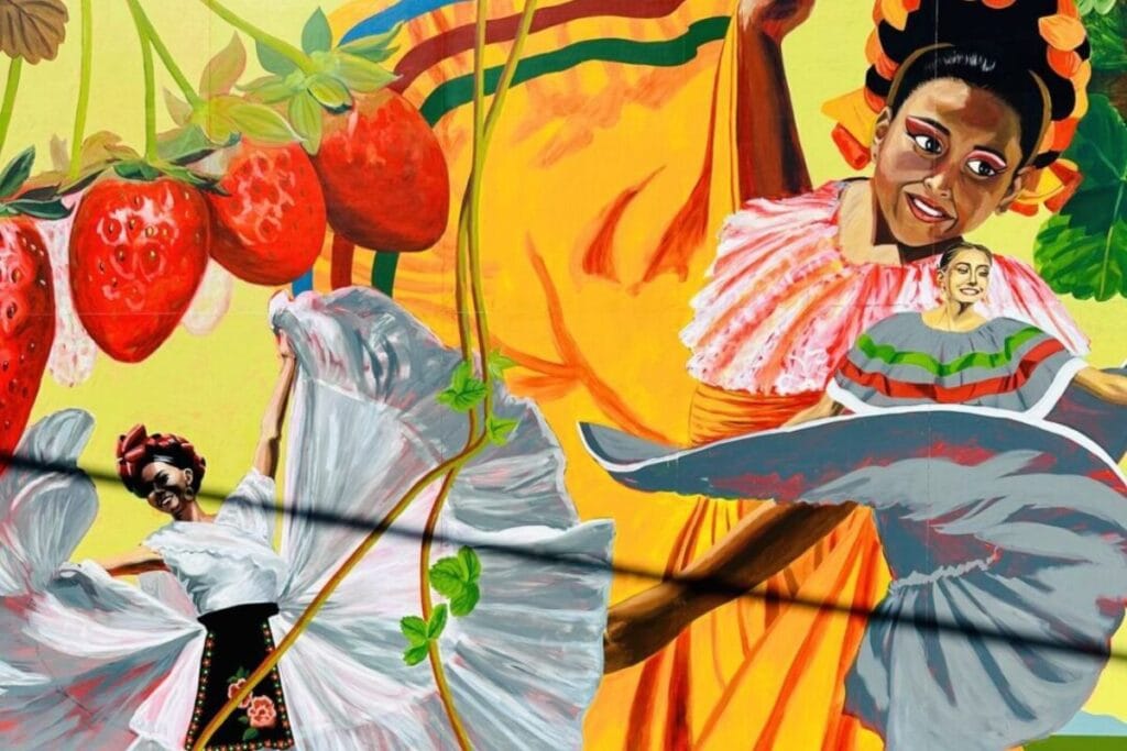 Colorful Burlington street mural with folklórico dancers and strawberries near the Skagit Valley Tulip Festival.